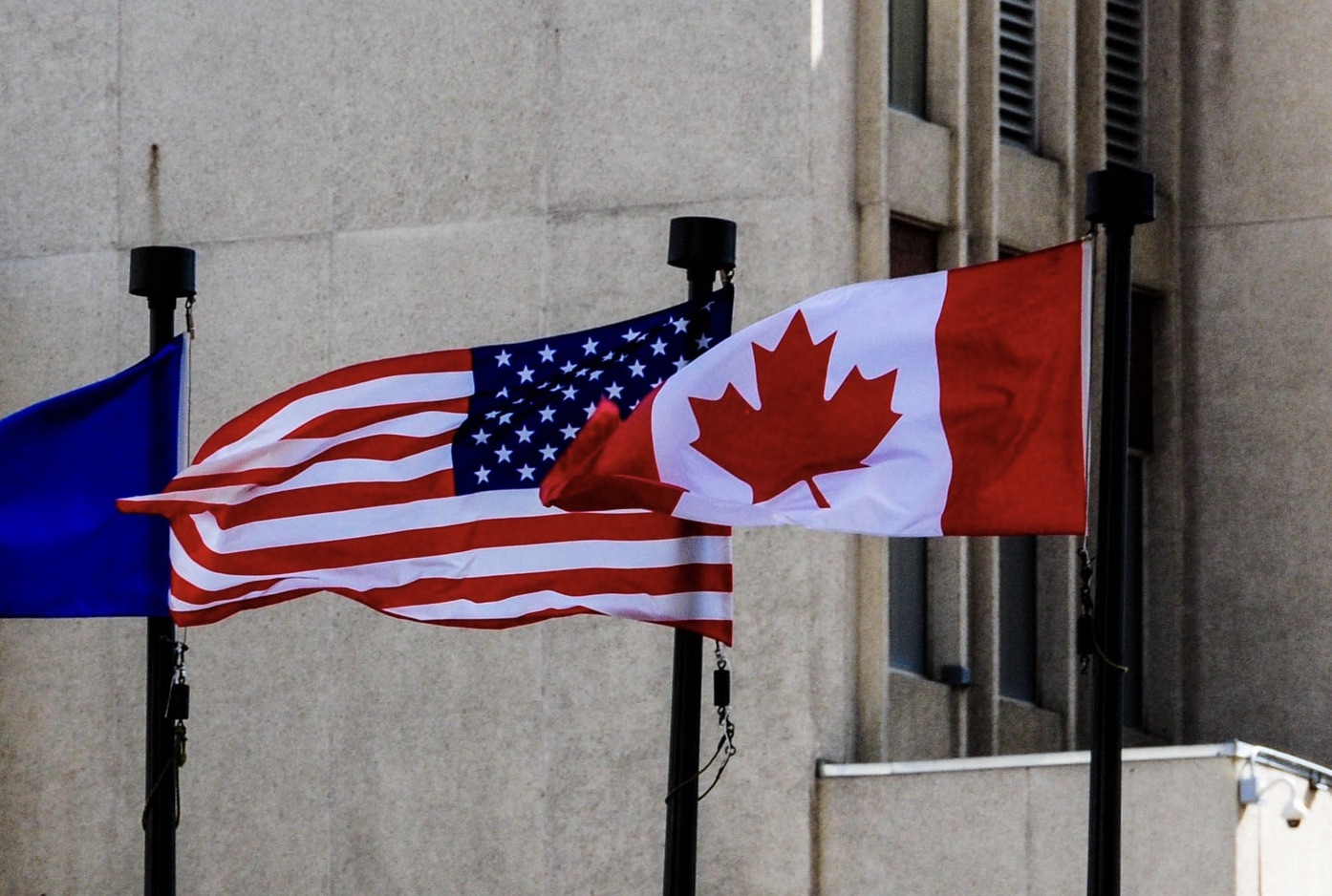The US and Canadian flags side by side