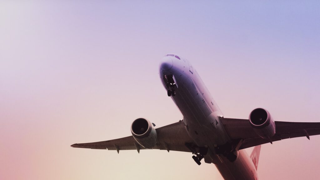 A commercial airplane representing air travel to the US from Canada