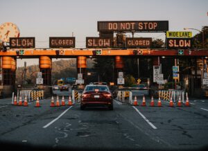 A car approaching a land border with most lanes closed