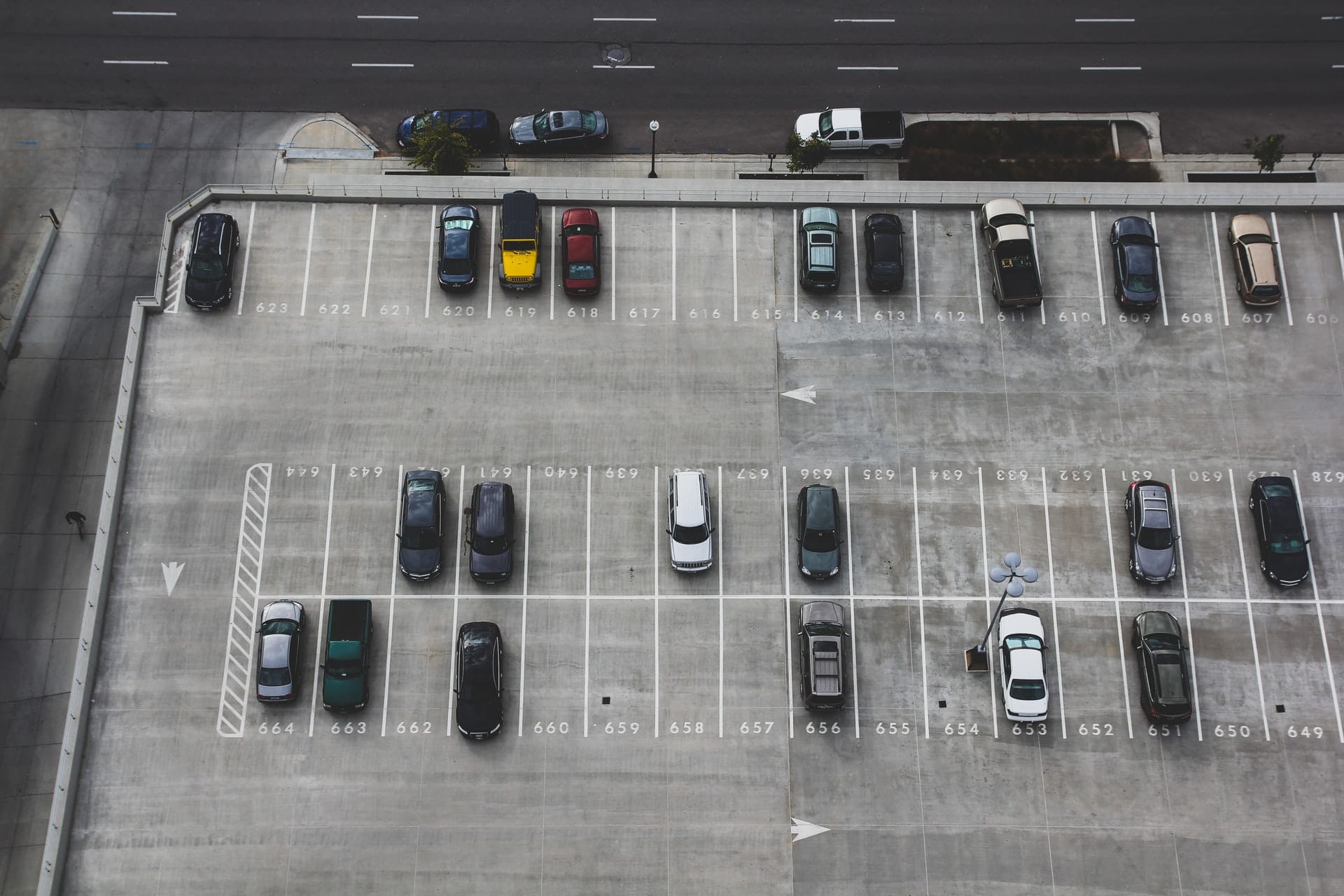 A parking lot representing cars being left for returning snowbirds so they can cross the border by foot to avoid a hotel stay