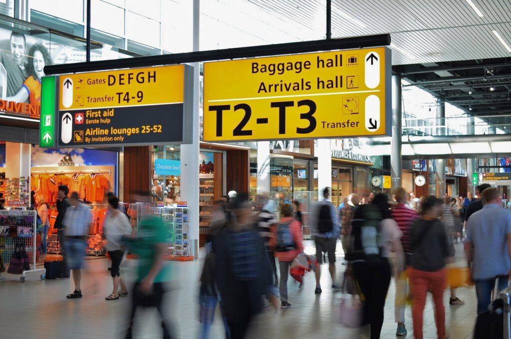 Arrivals sign at airport representing updated travel restrictions in Canada for summer 2021