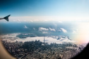 airplane flying over Toronto