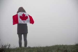 Person holding a Canadian flag