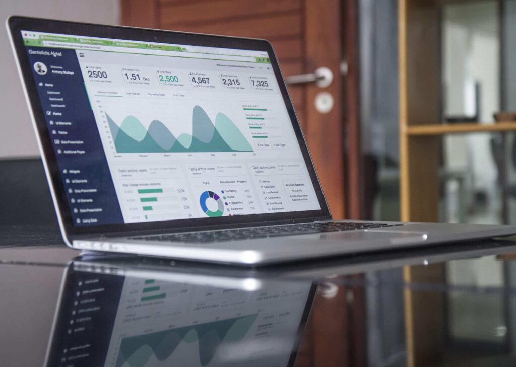 laptop with banking spreadsheet and graph on-screen