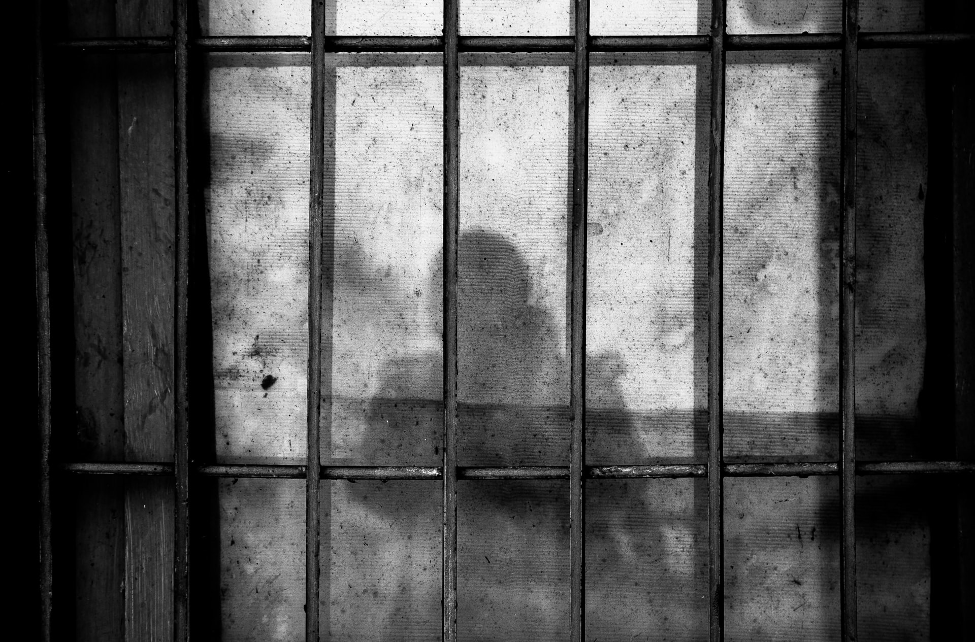 jail cell with a shadow of a person