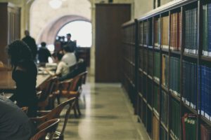 Studying in library representing new federal court decision granting officers authority to refuse entry to students with low grades