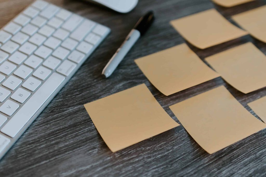 Post its and paper representing an employer pilot project making it easier for business to hire temporary foreign workers