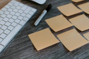 Post its and paper representing an employer pilot project making it easier for business to hire temporary foreign workers