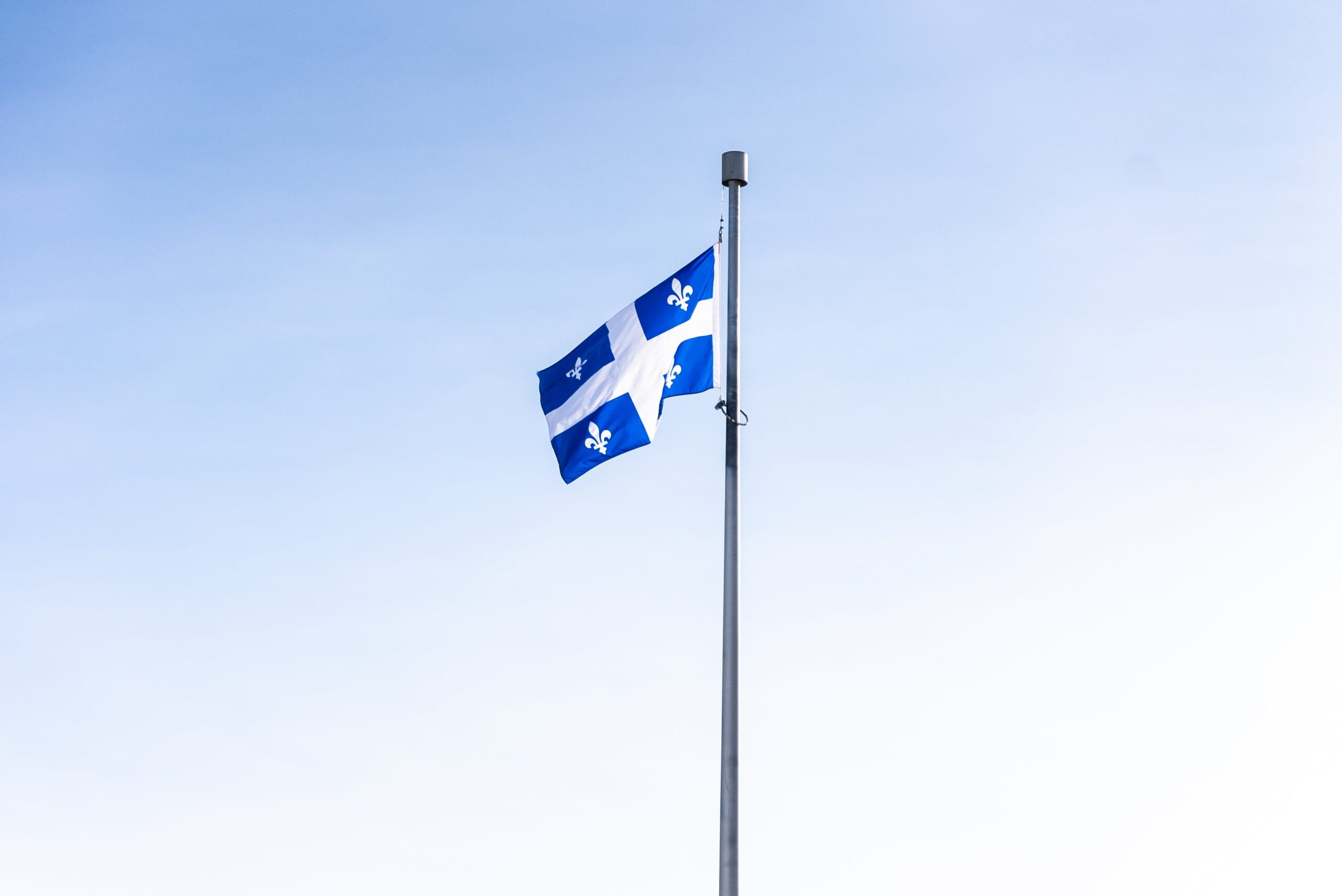 Quebec Flag representing immigration measures to promote Francophone communities outside of Quebec