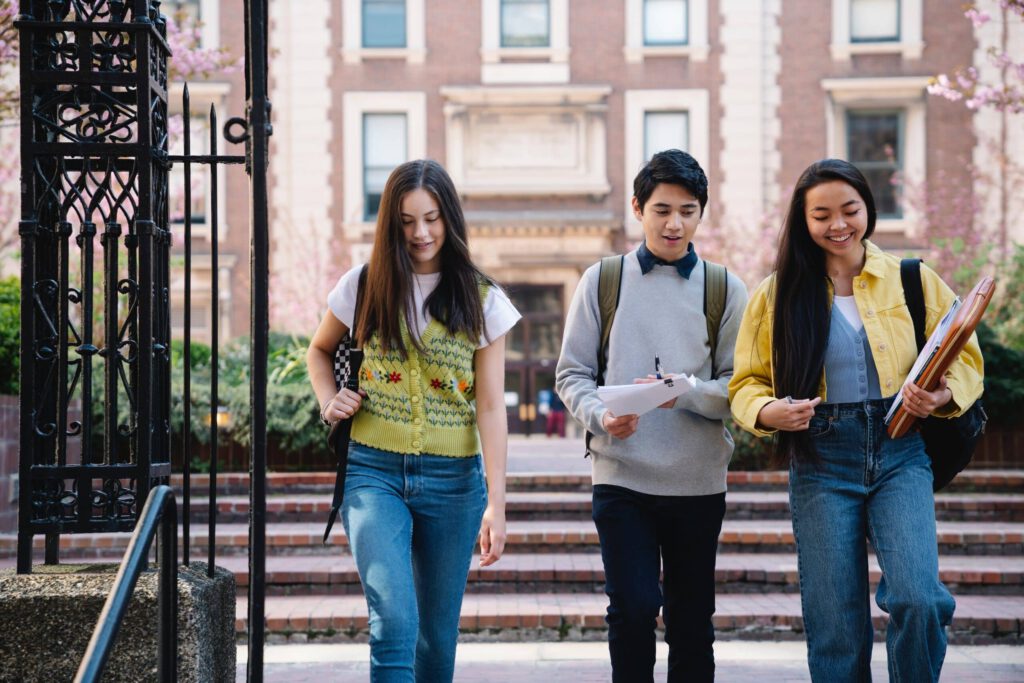 University students walking on campus representing changes for international students in Canada