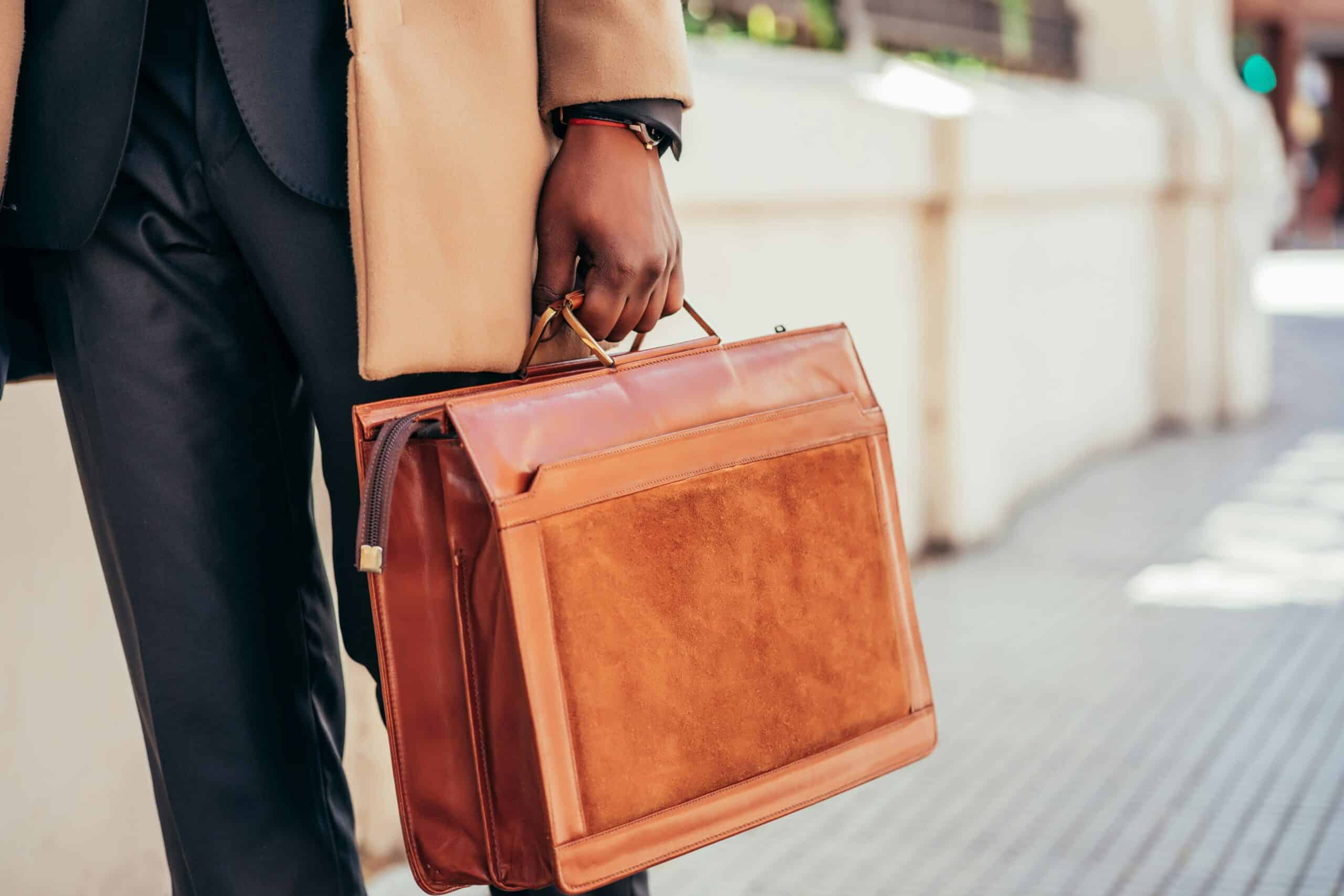 Person carrying a briefcase representing changes to the provincial nominee program