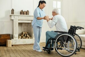 A home care worker assisting a patient in a wheelchair, representing the Home Care Immigration Pilot in Canada