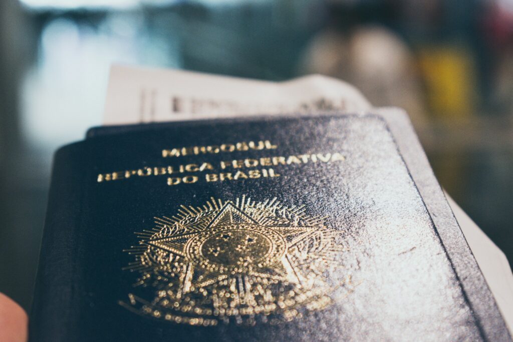 Close-up of a Brazilian passport, representing the US government's pausing of processing immigration visas from 75 countries.