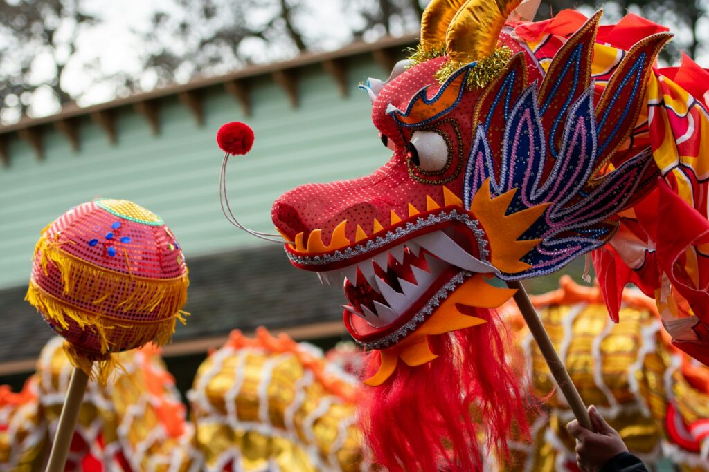 A red and gold Chinese dragon, representing Visa free travel to China.