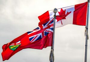 A Canadian and Ontario flag representing Ontario OINP permanent residence pathways.